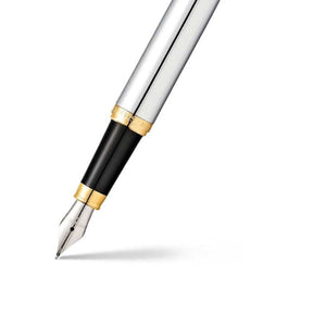 A Sheaffer VFM Polished Chrome fountain pen with gold trims on a white background.