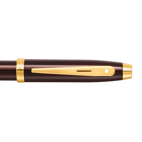 The Sheaffer® 100 9370 Glossy Coffee Brown Ballpoint Pen With PVD Gold-Tone Trim is a luxurious brown and gold pen that offers a remarkable writing experience. With its exquisite gold trim, this Sheaffer® pen is the perfect gift for any occasion.
